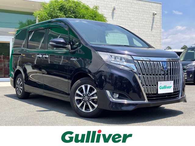 トヨタ エスクァイア ハイブリッド Gi 静岡県 2018(平30)年 4.9万km スパークリングブラックパールクリスタルシャイン エンジンスタートボタン/パワーステアリング/パワーウィンドウ/アイドリングストップ/スマートキー/Wオートエアコン/クルーズコントロール/後席用モニター/ETC/USB入力端子/バックカメラ/メモリナビ（CD.DVD.BT.フルセグ）/3列シート/ウォークスルー/純正フロアマット/純正アルミホイール/D席N席シートヒーター/両側パワースライドドア/ABS/レーンキープアシスト/オートライト/オートマチックハイビーム/LEDライト/Wエアバック/衝突軽減システム
