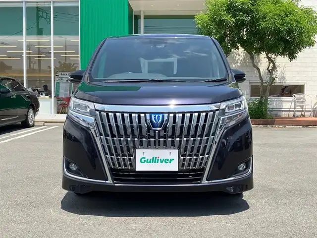 トヨタ エスクァイア ハイブリッド Gi 静岡県 2018(平30)年 4.9万km スパークリングブラックパールクリスタルシャイン エンジンスタートボタン/パワーステアリング/パワーウィンドウ/アイドリングストップ/スマートキー/Wオートエアコン/クルーズコントロール/後席用モニター/ETC/USB入力端子/バックカメラ/メモリナビ（CD.DVD.BT.フルセグ）/3列シート/ウォークスルー/純正フロアマット/純正アルミホイール/D席N席シートヒーター/両側パワースライドドア/ABS/レーンキープアシスト/オートライト/オートマチックハイビーム/LEDライト/Wエアバック/衝突軽減システム