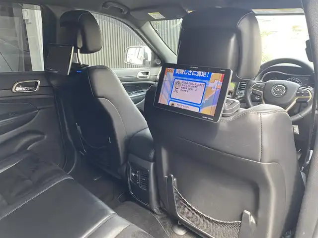 クライスラー・ジープ ジープ グランドチェロキー アルティテュード 福岡県 2015(平27)年 8.6万km ブライトホワイト 純正ナビ/CD/Bluetooth/USB/フルセグTV/後席社外モニター/クルーズコントロール/黒半革/シートヒーター/パワーシート/Bカメラ/ETC/スマートキー/スペアキー×1/オートワイパー/コーナーセンサー/HIDヘッドライト/保証書/取扱説明書