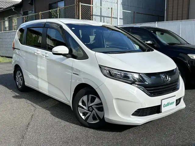 ホンダ フリード ハイブリット G ホンダセンシング 愛知県 2018(平30)年 2.2万km ホワイトオーキッドパール ワンオーナー/純ギャザーズSDナビテレビ/フルセグテレビ/バックカメラ/両側パワースライドドア/ホンダセンシング/ドライブレコーダー/ビルドインETC/プッシュエンジンスタート/LEDヘッドランプ/Cパッケージ/コンフォートパッケージ/新車保証書/取説/スペアキー