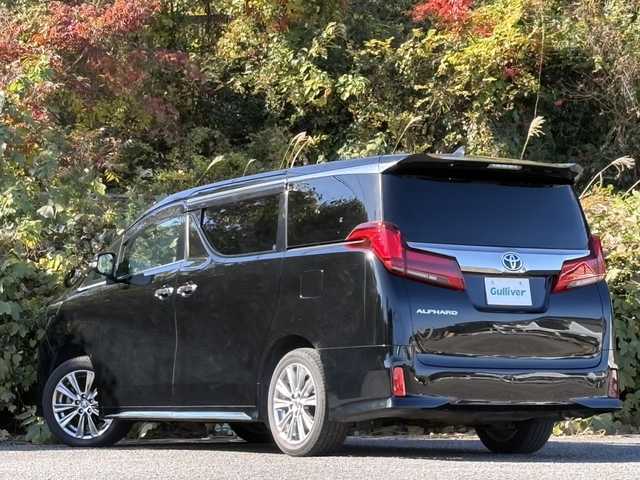 トヨタ アルファード S タイプゴールドⅢ 大分県 2022(令4)年 2.3万km ブラック 両側パワースライドドア /純正メモリーナビ/バックカメラ/フルセグ /Bluetooth/CD/DVDデッキ/ハーフレザーシート/ビルトインETC/オットマンシート/前後クリアランスソナー/純正3眼LEDヘッドライト/シーケンシャルウインカー/アダプティブクルーズコントロール/レーンキープアシスト/スマートキー/エンジンプッシュスタート/純正18インチアルミホイール