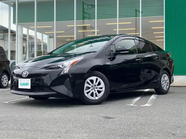 トヨタ プリウス S 静岡県 2018(平30)年 4.8万km アティチュードブラックマイカ エンジンスタートボタン/パワーステアリング/パワーウィンドウ/アイドリングストップ/スマートキー（スペアキー１本）/ETC/メモリナビ（ワンセグTV、CDチェンジャー）/バックカメラ/前後ドライブレコーダー/布系シート/純正アルミホイール/ABS/横滑り防止装置/盗難防止装置/オートライト/キセノンヘッドライト/W+サイドエアバック/カーテンエアバック/社外アルミホイール（スタッドレス）