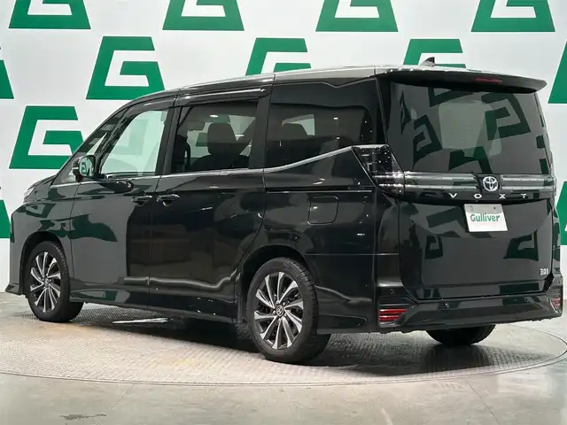 トヨタ ヴォクシー ハイブリッド S－Z 鹿児島県 2022(令4)年 3.8万km グリッターブラックガラスフレーク ワンオーナー/純正10.5インチディスプレイオーディオPlus/純正13.2インチ有機ELディスプレイ/バックカメラ/快適利便パッケージ/ドライビングサポートパッケージ/ブラインドスポットモニター/アドバンスドドライブ/パーキングサポートブレーキ/プロジェクター式LEDヘッドランプ/アダプティブハイビームシステム/両側パワースライドドア/純正ドライブレコーダー/純正ETC2.0/純正フロアマット/保証書/取説書