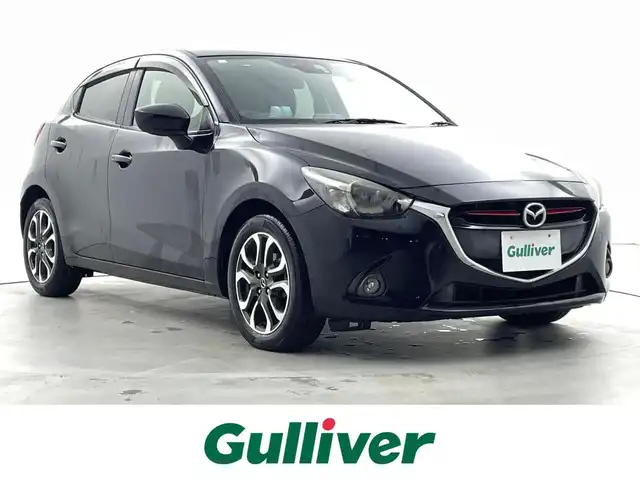 マツダ デミオ XD ツーリング 福井県 2015(平27)年 5.5万km ジェットブラックマイカ ディーゼル/純正マツダコネクトナビ/CD/DVD/フルセグTV/Bluetooth/USB/AM/FM/バックカメラ/衝突軽減ブレーキ/ETC/革巻きステアリング/ステアリングリモコン/ステアリングチルド機構/オートライト/フォグランプ/電動格納式ミラー/リアワイパー/社外シートカバー