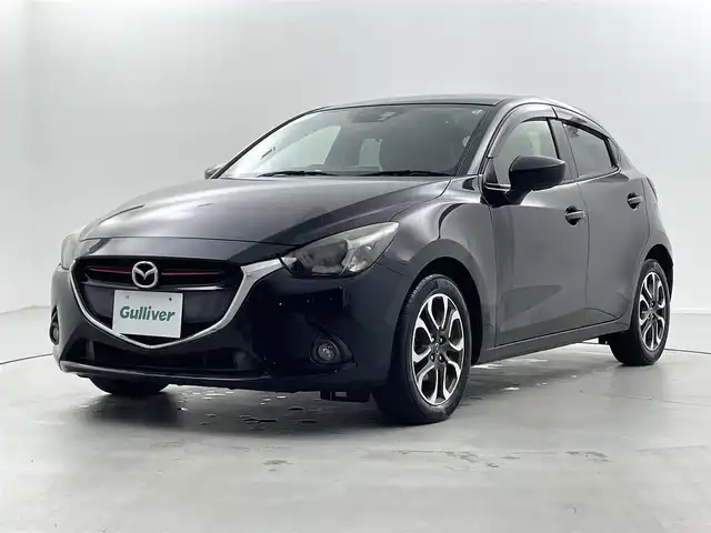 マツダ デミオ XD ツーリング 福井県 2015(平27)年 5.5万km ジェットブラックマイカ ディーゼル/純正マツダコネクトナビ/CD/DVD/フルセグTV/Bluetooth/USB/AM/FM/バックカメラ/衝突軽減ブレーキ/ETC/革巻きステアリング/ステアリングリモコン/ステアリングチルド機構/オートライト/フォグランプ/電動格納式ミラー/リアワイパー/社外シートカバー