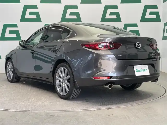 マツダ マツダ３セダン 20S プロアクティブ ツーリングS 鹿児島県 2023(令5)年 1.3万km マシーングレープレミアムM 禁煙車/アラウンドビューモニター/ブラインドスポットモニター/純正ナビ/　フルセグTV/　AppleCarplay/　AndroidAuto/　DVD/CD/　Bluetooth/　HDMI端子/前後ドライブレコーダー/ETC/電動パーキングブレーキ/オートブレーキホールド/ステアリングヒーター/運転席パワーシート/ドライビングポジションメモリー/前席シートヒーター/純正アルミホイール/電動格納ミラー/LEDヘッドライト