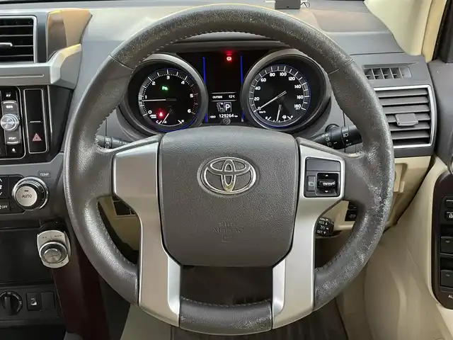 トヨタ ランドクルーザー プラド TX Lパッケージ 兵庫県 2015(平27)年 13万km ホワイトパールクリスタルシャイン モデリスタエアロ/サンルーフ/DN席シートヒーター/３列目電動シート/クルーズコントロール/ビルトインETC/純正アルミホイール/Bluetooth接続/ダウンヒルアシストコントロール/４WD/社外メモリナビ/オートマチックハイビーム/ヘッドライトウォッシャー/フルセグTV/スペアキー/スイッチスタート