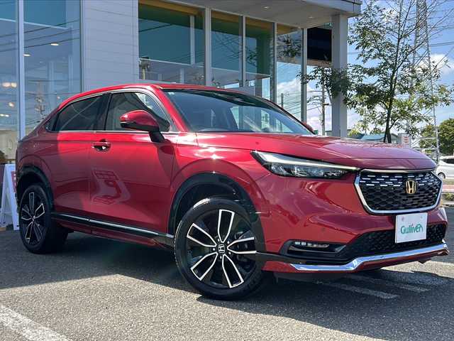 ホンダ ヴェゼル ハイブリッド e:HEV Z 秋田県 2021(令3)年 5.2万km プレミアムクリスタルレッドM ワンオーナー/４WD/純正9インチメモリナビ/フルセグTV/バックカメラ/ETC2.0/ドライブレコーダー/追従機能付クルーズコントロール/ホンダセンシング/ブラインドスポットインフォメーション/パドルシフト/ブラックハーフレザーシート/前席シートヒーター/純正フロアマット/OPグリル/純正エアロ（F/S/R）/純正18インチアルミ