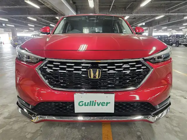 ホンダ ヴェゼル ハイブリッド e:HEV Z 秋田県 2021(令3)年 5.2万km プレミアムクリスタルレッドM 〇ワンオーナー/〇４WD/〇純正9インチナビ/〇フルセグTV/〇バックカメラ/〇純正ETC2.0/〇ドライブレコーダー/〇追従機能付クルーズコントロール/〇コーナーセンサー/〇ホンダセンシング/〇ブラインドスポットインフォメーション/〇LEDヘッドランプ/〇LEDフロントフォグランプ/〇ホンダコネクトディスプレイ/〇革巻きステアリングホイール/〇パドルシフト/〇左右独立温度調整オートエアコン/〇ブラックハーフレザーシート/〇前席シートヒーター/〇純正フロアマット/〇OPグリル/〇純正エアロ（F/S/R）/〇純正18インチアルミ/〇スマートキー/プッシュスタート/〇禁煙車