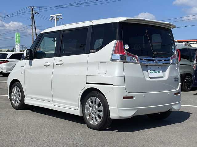 スズキ ソリオ HV MX 徳島県 2019(平31)年 8.2万km ピュアホワイトP 純正8型ナビ　CN-RZ843/（ラジオ/フルセグ/BT/USB/DISC）/バックカメラ/全方位カメラ/ビルトインETC/追従式クルーズコントロール/純正15インチアルミホイール/前方ドライブレコーダー/片側電動スライドドア/純正フロアマット/クリアランスソナー/D席シートヒーター/スマートキー/スペアキー/プッシュスタート