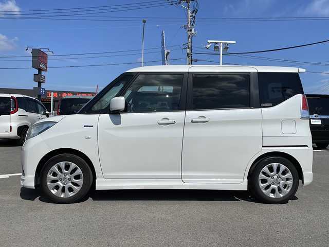スズキ ソリオ HV MX 徳島県 2019(平31)年 8.2万km ピュアホワイトP 純正8型ナビ　CN-RZ843/（ラジオ/フルセグ/BT/USB/DISC）/バックカメラ/全方位カメラ/ビルトインETC/追従式クルーズコントロール/純正15インチアルミホイール/前方ドライブレコーダー/片側電動スライドドア/純正フロアマット/クリアランスソナー/D席シートヒーター/スマートキー/スペアキー/プッシュスタート