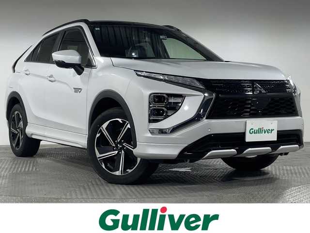 三菱 エクリプス クロス ＰＨＥＶ P 神奈川県 2021(令3)年 1.7万km ホワイトダイヤモンド e-Assist/・衝突被害軽減ブレーキシステム/・誤発進抑制機能（前進＆後退時）/・車線逸脱警報システム/・オートマチックハイビーム/・後側方車両検知警報システム（レーンチェンジアシスト機能付き）/・後退時交差車両検知警報システム/純正ディスプレイオーディオ/・BT/フルセグTV/USB/AM/FM/全方位カメラ/サンルーフ/レザーシート/パワーシート(D/N)/シートヒーター(D/N)/電動サイドブレーキ/オートホールド/革巻きステアリング/ステアリングスイッチ/パドルシフト/Autoライト/ステアリングヒーター/BSM/HUD/スマートキー/プッシュスタートボタン/AC1500W/バッテリー冷却/へヘッドライトレベライザー/ETC/前後ドライブレコーダー/コーナーセンサー/自動防眩ミラー/LEDヘッドライト/フォグランプ/電動格納ミラー/ウィンカーミラー/ルーフレール/純正フロアマット/純正アルミホイール
