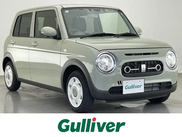 スズキ ラパン ＬＣ L 愛知県 2024(令6)年 0.3万km トラッドカーキメタリック 全方位モニター用カメラＰＫＧ装着車　デュアルカメラブレーキ　衝突軽減装置　車線逸脱　リヤパーキングセンサー　ＬＥＤオートライト　プッシュスタート　ハーフレザー　シートヒーター　純正フロアマット　禁煙車