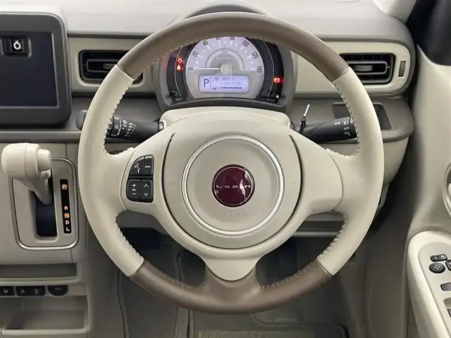 スズキ ラパン ＬＣ L 愛知県 2024(令6)年 0.3万km トラッドカーキメタリック 全方位モニター用カメラＰＫＧ装着車　デュアルカメラブレーキ　衝突軽減装置　車線逸脱　リヤパーキングセンサー　ＬＥＤオートライト　プッシュスタート　ハーフレザー　シートヒーター　純正フロアマット　禁煙車