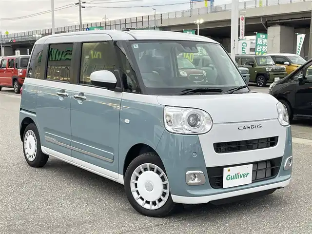 ダイハツ ムーヴ キャンバス ストライプス G 石川県 2024(令6)年 0.2万km シャイニングホワイトパール/レイクブルーメタリック 純正ディスプレイオーディオ/全方位カメラ/LEDヘッドライト/スマートアシスト/オートライト/両側パワースライドドア/レーンキープアシスト/クリアランスソナー/プッシュスタート/電動ミラー/ベンチシート/保証書