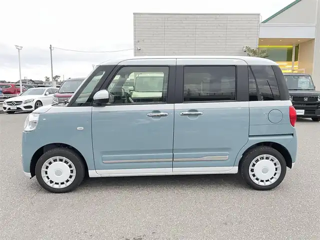 ダイハツ ムーヴ キャンバス ストライプス G 石川県 2024(令6)年 0.2万km シャイニングホワイトパール/レイクブルーメタリック 純正ディスプレイオーディオ/全方位カメラ/LEDヘッドライト/スマートアシスト/オートライト/両側パワースライドドア/レーンキープアシスト/クリアランスソナー/プッシュスタート/電動ミラー/ベンチシート/保証書