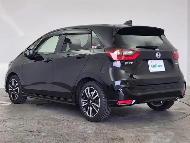 ホンダ フィット e:HEV RS 愛知県 2024(令6)年 0.2万km 黒 ホンダセンシング/　・衝突軽減ブレーキ/　・誤発進抑制機能/　・後方誤発進抑制機能/　・近距離衝突軽減ブレーキ/　・歩行者事故低減ステアリング/　・路外逸脱抑制機能/　・渋滞追従機能付アダプティブクルーズコントロール/　・車線維持支援システム/　・トラフィックジャムアシスト/　・先行車発進お知らせ機能/　・標識認識機能/　・オートハイビーム/純正ナビ/（Bluetooth/フルセグTV/USB）/バックカメラ/ETC2.0/ドライブレコーダー/ハーフレザー/オートライト/電子パーキング/オートホールド/ドアバイザー/純正フロアマット/パドルシフト/純正LEDライト