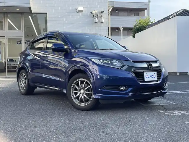 ホンダ ヴェゼル ハイブリッド Z 埼玉県 2014(平26)年 12.3万km モルフォブルーP (株)IDOMが運営する【じしゃロン鳩ヶ谷店】の自社ローン専用車両になりますこちらは現金またはオートローンご利用時の価格です。自社ローンご希望の方は別途その旨お申付け下さい/あんしんパッケージ/・シティブレーキアクティブシステム/・サイド&カーテンエアバッグ/HONDAインターナビ/　(CD/DVD/Bluetooth接続)/フルセグTV/バックカメラ/ビルドインETC/前後ドライブレコーダー/クルーズコントロール/パドルシフト/ハーフレザーシート/シートヒーター/LEDヘッドライト