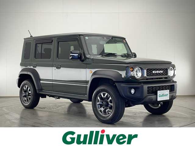 スズキ ジムニー ノマド FC 宮崎県 2025(令7)年 0.1万km 緑 ワンオーナー/SUZUKI Safety Support/〇デュアルカメラブレーキサポート/〇デュアルセンサーブレーキサポート/〇先行車発進お知らせ機能/〇標識認識機能/〇アダプティブクルーズコントロール（ACC）/〇車線逸脱警報機能/〇ふらつき警報機能/〇後退時ブレーキサポート/〇誤発進抑制機能/〇後方誤発進抑制機能/〇ハイビームアシスト/〇コーナーセンサー/純正8インチSDナビ/フルセグTV/CD/DVD/Bluetooth/バックカメラ/シートヒーター/LEDヘッドライト/純正１５インチAW/純正フロアマット/前後ドライブレコーダー/ETC/スマートキー×2/保証書/取扱説明書