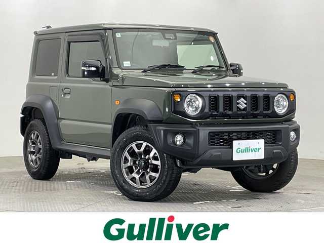 スズキ ジムニー シエラ JC 栃木県 2022(令4)年 1.8万km ジャングルグリーン 社外ナビ/(フルセグTV/SD/CD/DVD)/禁煙車/ヘッドライトウォッシャー/4WD/バックカメラ/衝突軽減ブレーキ/シートヒーター/オートライト/LEDヘッドライト/横滑り防止装置/フォグランプ/スマートキー/プッシュスタート/アイドリングストップ/ステアリングスイッチ/電動格納ミラー/純正15インチアルミホイール/純正フロアマット