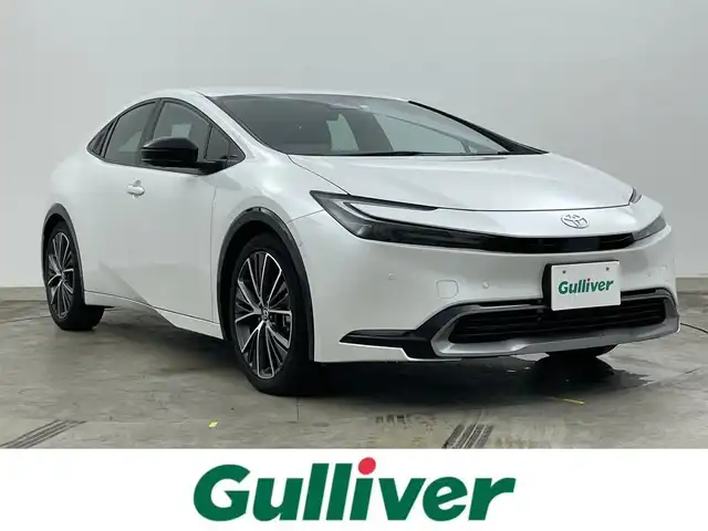 トヨタ プリウス Z 岡山県 2023(令5)年 1.2万km プラチナホワイトパールマイカ 純正12.3インチディスプレイオーディオ/(Bluetooth/フルセグTV/Carplay/USB)/置くだけ充電/パノラミックビューモニター/ビルトインETC2.0/ステアリングヒーター/D席メモリー付パワーシート/D/N席シートヒーター/D/N席シートベンチレーション/パワーバックドア/100V電源/オートハイビーム/コーナーセンサー/レーンキープアシスト/レーダークルーズコントロール/ブラインドスポットモニター/純正19インチアルミホイール/純正フロアマット