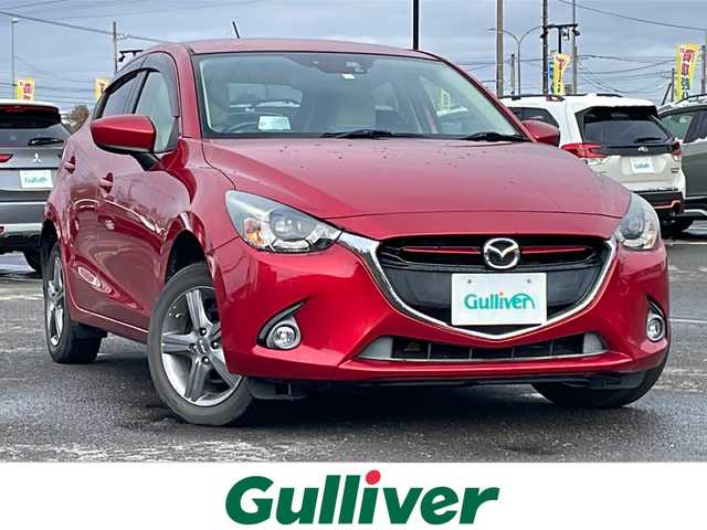 マツダ デミオ XD ツーリング Lパッケージ 道央・札幌 2014(平26)年 12.3万km ソウルレッドプレミアムメタリック ４WD/純正メモリーナビ/AM/FM/BT/CD/DVD/フルセグ/衝突被害軽減ブレーキ/横滑り防止装置/クルーズコントロール/ビルトインETC/アイドリングストップ/ハーフレザーシート/革巻きステアリング/ステアリングリモコン/パドルシフト/MTモード付AT/プッシュスタート/スマートキー/LEDヘッドライト/オートライト/フォグランプ/電動格納ミラー/ウィンカーミラー/純正フロアマット/ドアバイザー/スペアキー