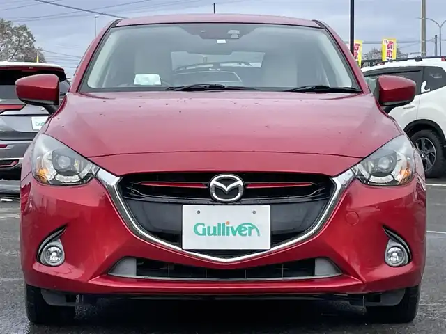 マツダ デミオ XD ツーリング Lパッケージ 道央・札幌 2014(平26)年 12.3万km ソウルレッドプレミアムメタリック ４WD/純正メモリーナビ/AM/FM/BT/CD/DVD/フルセグ/衝突被害軽減ブレーキ/横滑り防止装置/クルーズコントロール/ビルトインETC/アイドリングストップ/ハーフレザーシート/革巻きステアリング/ステアリングリモコン/パドルシフト/MTモード付AT/プッシュスタート/スマートキー/LEDヘッドライト/オートライト/フォグランプ/電動格納ミラー/ウィンカーミラー/純正フロアマット/ドアバイザー/スペアキー