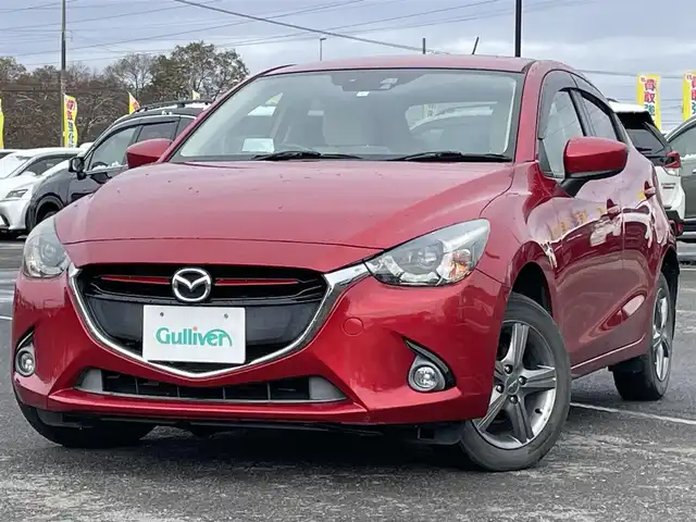 マツダ デミオ XD ツーリング Lパッケージ 道央・札幌 2014(平26)年 12.3万km ソウルレッドプレミアムメタリック ４WD/純正メモリーナビ/AM/FM/BT/CD/DVD/フルセグ/衝突被害軽減ブレーキ/横滑り防止装置/クルーズコントロール/ビルトインETC/アイドリングストップ/ハーフレザーシート/革巻きステアリング/ステアリングリモコン/パドルシフト/MTモード付AT/プッシュスタート/スマートキー/LEDヘッドライト/オートライト/フォグランプ/電動格納ミラー/ウィンカーミラー/純正フロアマット/ドアバイザー/スペアキー