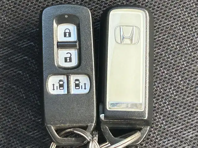 ホンダ Ｎ ＢＯＸ カスタム SSパッケージ 熊本県 2014(平26)年 6.4万km プレミアムホワイトパール 純正ナビ/・AM/FM/CD/DVD/BT/USB/・ワンセグTV/・バックカメラ/衝突軽減ブレーキ/横滑り防止装置/オートライト/HIDヘッドライト/フォグランプ/前席シートヒーター/革巻きステアリング/ステアリングスイッチ/両側電動スライドドア/純正フロアマット/純正アルミホイール/ドアバイザー/電動格納ミラー/ウインカーミラー/プッシュススタート