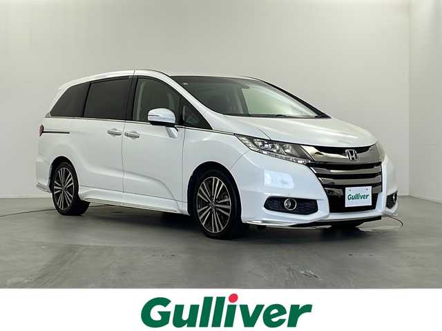 ホンダ オデッセイ アブソルート EX 栃木県 2014(平26)年 10.3万km ホワイトオーキッドパール 純正ナビ/（DVD/CD/AM・FM/BT/TV)/バックカメラ/横滑り防止装置/ブラインドストップモニター/アイドリングストップ/ETC/D席電動シート/後席オットマン/両側パワースライドドア/電動格納ミラー/ウインカーミラー/ステアリングリモコン/革巻きステアリング/純正１８インチAW/LEDライト