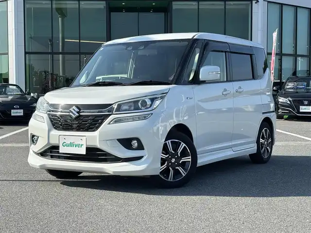 スズキ ソリオ バンディット HV MV 奈良県 2018(平30)年 6.5万km ピュアホワイトP 両側パワースライドドア/社外ナビ(フルセグTV/CD/DVD/AM・FM/BT/iPod)/バックカメラ/ETC/スズキセーフティサポート/誤発進抑制機能/車線逸脱警報機能/先行車発進お知らせ機能/クルーズコントロール/パドルシフト/運転席シートヒーター/本革巻きステアリング/LEDヘッドライト/純正15インチアルミホイール/純正フロアマット/後席サンシェード/スペアキー
