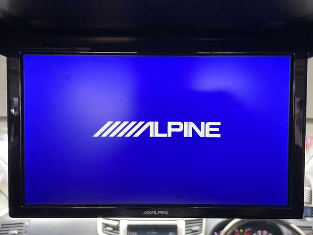 トヨタ ヴェルファイア 2．4Z ゴールデンアイズ 福岡県 2013(平25)年 6万km ブラック ALPINEナビ（Bluetooth・フルセグTV・CD・DVD再生）ALPINE後席用モニター/ドライブレコーダー/Verthandiアルミホイール/両側パワースライドドア/クリアランスソナー/電動リアゲート/GPSレーダー/ウッドコンビステアリング/電動格納ミラー/エアバッグ（運転席・助手席・サイド）/クルーズコントロール/パーキングアシスト/スマートキー/スペアキー/バックカメラ/プッシュスタート/3列シート/オットマン/ABS/横滑り防止装置/パワーステアリング/パワーウィンドウ/カーテンエアバッグ/保証書/取扱説明書