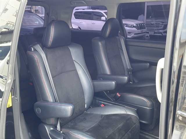 トヨタ ヴェルファイア 2．4Z ゴールデンアイズ 福岡県 2013(平25)年 6万km ブラック ALPINEナビ（Bluetooth・フルセグTV・CD・DVD再生）ALPINE後席用モニター/ドライブレコーダー/Verthandiアルミホイール/両側パワースライドドア/クリアランスソナー/電動リアゲート/GPSレーダー/ウッドコンビステアリング/電動格納ミラー/エアバッグ（運転席・助手席・サイド）/クルーズコントロール/パーキングアシスト/スマートキー/スペアキー/バックカメラ/プッシュスタート/3列シート/オットマン/ABS/横滑り防止装置/パワーステアリング/パワーウィンドウ/カーテンエアバッグ/保証書/取扱説明書