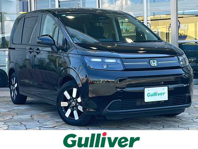 ホンダ フリード ハイブリット e:HEV AIR EX 愛知県 2024(令6)年 0.1万km クリスタルブラックパール ホンダセンシング/・衝突軽減ブレーキ /・誤発進抑制機能/・歩行者事故低減ステアリング/・路外逸脱抑制機能/・先行車追従機能/・標識認識機能/純正ナビ/・ラジオ/・フルセグTV/ipod/Bluetooth/USB/主要装備/・両側パワースライドドア　/・レーダークルーズコントロール　/・バックカメラ　/・ＥＴＣ　/・アイドリングストップ　/・純正アルミホイール　/・ＬＥＤヘッドライト　/・ＢＳＭ/・オートホールド/・ステアリングリモコン/・プッシュスタート/・スマートキー/・オートライト