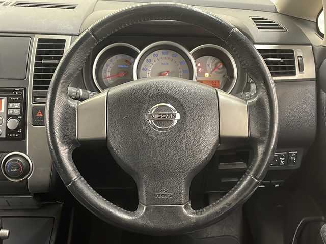 日産 ティーダ 15M FOUR 道央・札幌 2010(平22)年 10.9万km 黒 純正オーディオ/4WD/純正フロアマット/ETC