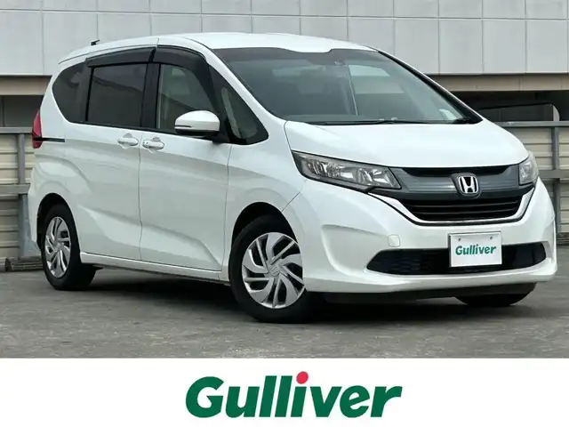 ホンダ フリード G ホンダセンシング 静岡県 2017(平29)年 2.3万km ホワイトオーキッドパール 社外7インチナビ/（FM/AM/Bluetooth/CD/DVD）/ホンダセンシング/クルーズコントロール/両側パワースライドドア/ETC/レーンキープアシスト/3列シート/チップアップシート/ドラレコ/スマートキー/プッシュスタート/エアバッグ/純正15AW