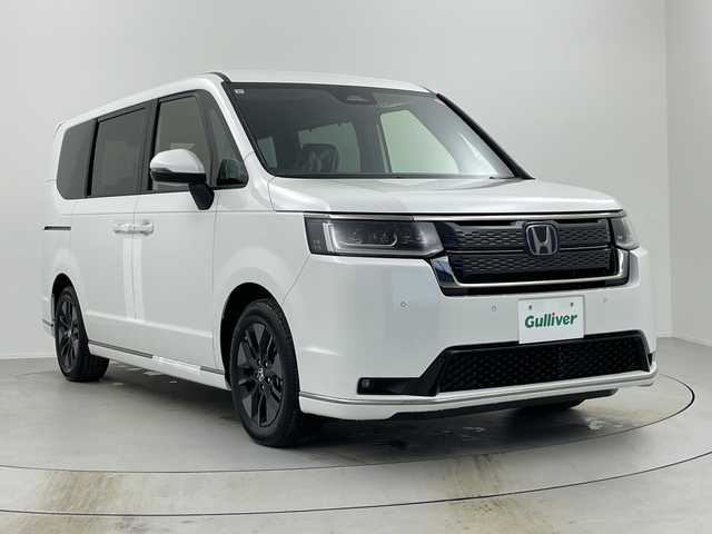 ホンダ ステップワゴン スパーダ eHEV 奈良県 2025(令7)年 0.1千km プラチナホワイトパール 登録済み未使用車/ナビ装着パッケージ/レーダークルーズコントロール/路外逸脱抑制システム/BSI/踏み間違い防止/コーナーセンサー/CMBS/両側パワースライドドア/パワーテールゲート/ハーフレザーシート/シートヒーター/ISOFIX/電子パーキング/BREAK HOLD/LEDヘッドライト/LEDフォグライト/オートライト/オートハイビーム/純正16インチアルミホイール/スマートキー/スペアキー