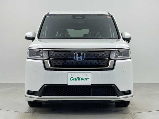 ホンダ ステップワゴン スパーダ eHEV 奈良県 2025(令7)年 0.1千km プラチナホワイトパール 登録済み未使用車/ナビ装着パッケージ/レーダークルーズコントロール/路外逸脱抑制システム/BSI/踏み間違い防止/コーナーセンサー/CMBS/両側パワースライドドア/パワーテールゲート/ハーフレザーシート/シートヒーター/ISOFIX/電子パーキング/BREAK HOLD/LEDヘッドライト/LEDフォグライト/オートライト/オートハイビーム/純正16インチアルミホイール/スマートキー/スペアキー