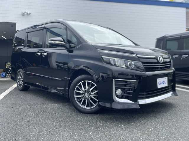 トヨタ ヴォクシー ZS 熊本県 2014(平26)年 10.4万km ブラック (株)IDOMが運営する【じしゃロン〇〇店】の自社ローン専用車両になります。こちらは現金またはオートローンご利用時の価格です。自社ローンご希望の方は別途その旨お申付け下さい/純正ナビ（フルセグ　ＢＴ）/バックカメラ　/両側パワースライドドア　/アイドリングストップ　/ビルトインＥＴＣ　/ＬＥＤヘッドライト　/Ｗ＋サイドエアバッグ　/純正アルミ