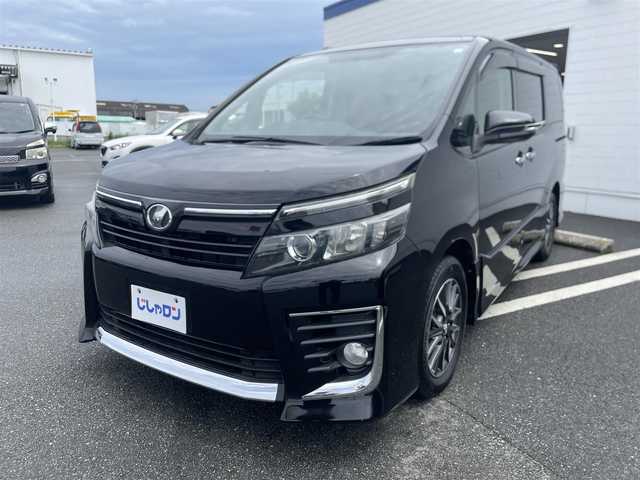 トヨタ ヴォクシー ZS 熊本県 2014(平26)年 10.4万km ブラック (株)IDOMが運営する【じしゃロン〇〇店】の自社ローン専用車両になります。こちらは現金またはオートローンご利用時の価格です。自社ローンご希望の方は別途その旨お申付け下さい/純正ナビ（フルセグ　ＢＴ）/バックカメラ　/両側パワースライドドア　/アイドリングストップ　/ビルトインＥＴＣ　/ＬＥＤヘッドライト　/Ｗ＋サイドエアバッグ　/純正アルミ