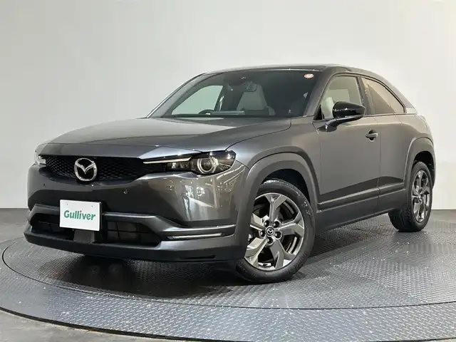マツダ ＭＸ－３０ 愛媛県 2022(令4)年 3.5万km マシーングレープレミアムM ・ベーシックＰＫＧ＋モダンコンフィデンスパッケージ/・エクステリアＰＫＧ/・インテリアＰＫＧ（ホワイト内装）/・３６０°セーフティＰＫＧ/・ボーズサウンドシステム（ＡＵＤＩＯＰＩＬＯＴ２＋Ｃｅｎｔｅｒｐｏｉｎｔ２）＋１２スピーカー/・ユーティリティＰＫＧ/・セーフティＰＫＧ/・１０型ナビ/（フルセグＴＶ・ＢＴ・ＦＭ・ＡＭ・ＵＳＢ・ａｐｐｌｅｃａｒｐｌａｙ・ＨＤＭＩ）/・全方位カメラ　/・ＥＴＣ　/・前後ドラレコ　/・衝突軽減ブレーキ　/・レーンキープアシスト　/・レーダークルーズコントロール/・D席パワーシート/・DN席シートヒーター/・ステアリングヒーター/・BOSEプレミアムサウンド/・シートメモリー/・オートマチックハイビーム/・スペアキー
