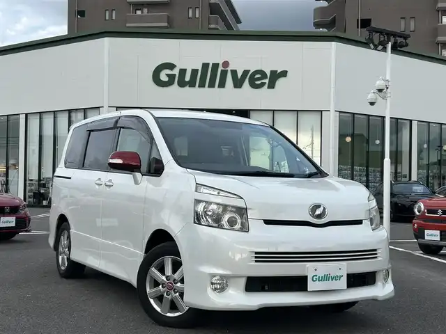 トヨタ ヴォクシー ZS 長崎県 2007(平19)年 7.8万km ホワイトパールクリスタルシャイン 純正SDナビ/ワンセグテレビ/バックカメラ/CD・DVD/フリップダウンモニター/片側パワスラ/純正アルミホイール/ETC