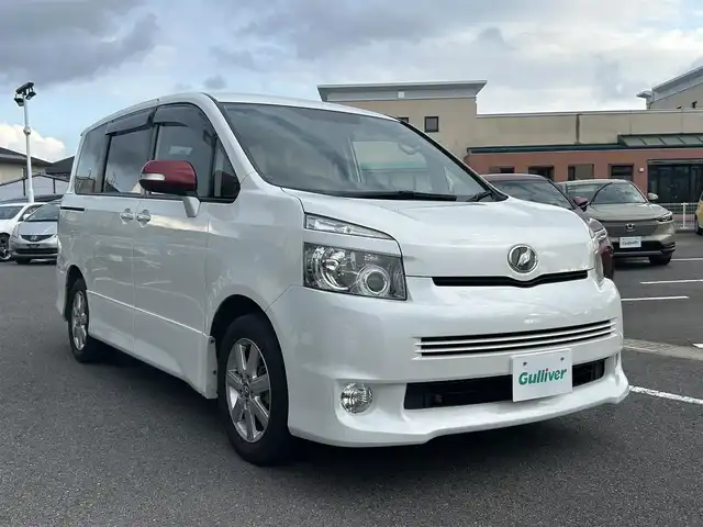 トヨタ ヴォクシー ZS 長崎県 2007(平19)年 7.8万km ホワイトパールクリスタルシャイン 純正SDナビ/ワンセグテレビ/バックカメラ/CD・DVD/フリップダウンモニター/片側パワスラ/純正アルミホイール/ETC