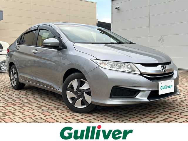ホンダ グレイス ハイブリッド LX 鳥取県 2015(平27)年 4.2万km ティンテッドシルバーM スマートキーx2個/シティブレーキサポート/オートフェンダーポール/ドライブレコーダー/GPSレーダー/メーカーインターナビ/フルセグ・Bluetooth/HDMI/USB/バックカメラ/TVキャンセラー/前席シートヒーター/オートエアコン/オートライト/LEDヘッドライト/リアスポイラー/ビルトインETC/保証書・取説