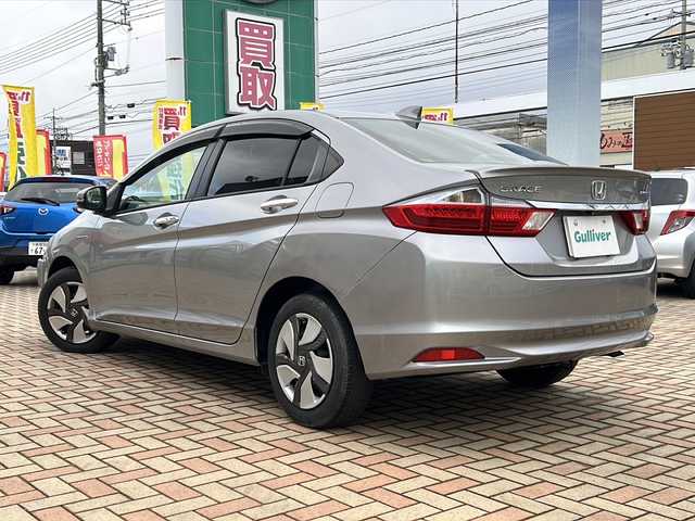 ホンダ グレイス ハイブリッド LX 鳥取県 2015(平27)年 4.2万km ティンテッドシルバーM スマートキーx2個/シティブレーキサポート/オートフェンダーポール/ドライブレコーダー/GPSレーダー/メーカーインターナビ/フルセグ・Bluetooth/HDMI/USB/バックカメラ/TVキャンセラー/前席シートヒーター/オートエアコン/オートライト/LEDヘッドライト/リアスポイラー/ビルトインETC/保証書・取説