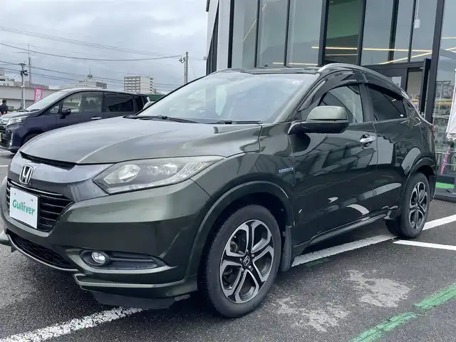 ホンダ ヴェゼル ハイブリッド Z 長崎県 2014(平26)年 12.4万km ミスティックグリーンパール ワンオーナー/純正メモリナビ/（ワンセグ・DVD・BT・CD・SD)/ハーフレザーシート/シートヒーター/パドルシフト/クルーズコントロール/オートライト/HID/ETC/横滑り防止/バックカメラ/スマートキー/スペアキー