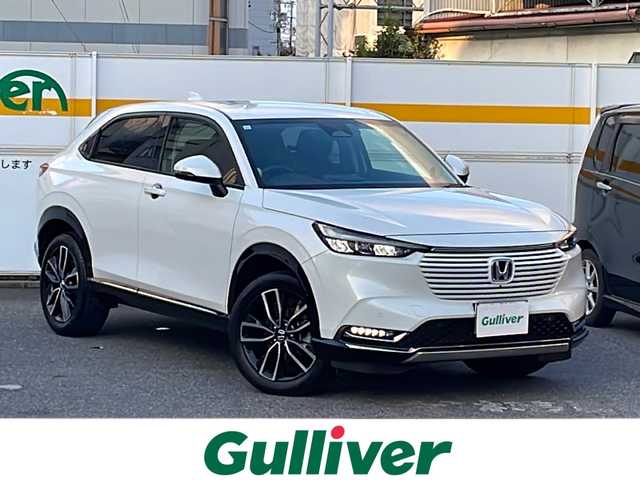 ホンダ ヴェゼル ハイブリッド e:HEV Z 愛知県 2023(令5)年 1.9万km プラチナホワイトパール /禁煙車//ワンオーナー//メーカーナビ//フルセグ/BT/USB/FM/AM//マルチビューカメラシステム//ハンズフリーパワーテールゲート//予約クローズ//純正18AW//HONDA SENSING//CMBS//ACC//先行車発進お知らせ//路外逸脱抑制システム//標識認識機能//踏み間違い衝突軽減システム//歩行者事故軽減システム//LKAS(車線維持支援システム）//BSM//パーキングセンサーシステム//ビルトインETC2.0//前後ドライブレコーダー//ワイヤレス充電//HONDA純正マフラーカッター(08F53-3M0)//LEDオートライト//オートハイビーム//Fフォグ//DRIVE MODE//SPORT/NORMAL/ECON//ヒルディセントコントロール//電子パーキング//BRAKE HOLD//プッシュスタート//黒ハーフレザーシート//前席シートヒーター//革巻ステアリング//パドルシフト//ステアリングヒーター//防眩ルームミラー//ステアリングスイッチ//純正フロアマット//リアサンシェード//USB充電//新車時保証書//取扱説明書/ナビ取説//スマートキー//スマートスペアキー