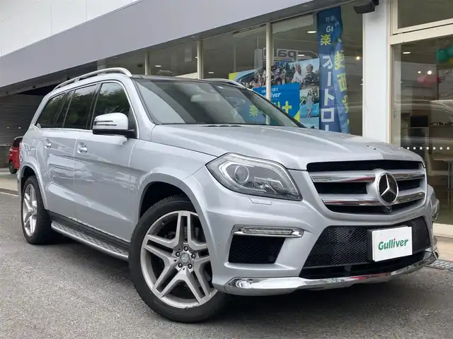 メルセデス・ベンツ ＧＬ５５０ 4MATIC AMGエクスクルーシブ 長崎県 2013(平25)年 5万km イリジウムシルバー 左ハンドル車/サンルーフ/電動稼働黒革シート/(シートヒーター・エアシート)/後席モニター/プレミアムサウンド【harman/kardon】/メーカーOP・HDDナビ/(Bluetooth接続・フルセグTV・DVD再生)/全方位カメラ・バックカメラ/レーダークルーズコントロール/レーンキープアシスト/衝突被害軽減ブレーキ/後方車両接近警報/パワーバックドア/ETC/ダウンヒルアシスト/コーナーセンサー/ウッドコンビステアリング/ステアリングスイッチ/パドルシフト/LEDオートヘッドライト