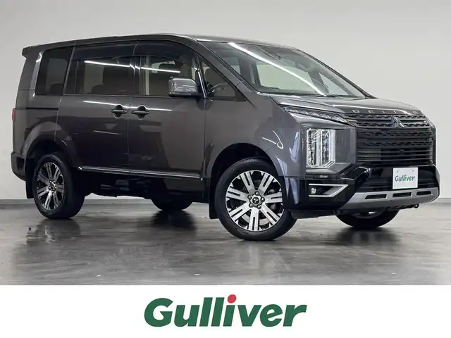 三菱 デリカＤ：５ G 三重県 2020(令2)年 3.8万km アイガーグレーM/ダイヤモンドブラックマイカ ディーゼル・ターボ/フルタイム4WD/MTモード付インパネ8AT/純正 10.1インチナビ『ROAD EXPLORER MM』 QY-9000M-C/（FM/AM/CD/DVD/TV/SD/Music Catcher/USB/iPod/Bluetooth/HDMI/AUX）/純正 10.1インチ 後席モニター/【OP】マルチアラウンドモニター/両側オートスライドドア/ビルトインETC/e-Assist/・衝突被害軽減ブレーキシステム［FCM］/・車線逸脱警報システム［LDW］/・レーダークルーズコントロールシステム［ACC］/・オートハイビーム［AHB］/・誤発進抑制機能（前進時）/など/装備/・キャプテンシート（7人乗り）/・左右独立オートエアコン/・後席クーラー＆ヒーター/・AC100V電源コンセント（100W）/・オートライト/・LED ヘッドランプ＋フロントフォグランプ/・パドルシフト/・電動パーキングブレーキ＆ブレーキオートホールド機能/・モード切替4WD/・純正18inAW/・プッシュスタート/・保/取/ナビ取/・スマートキーx2/など