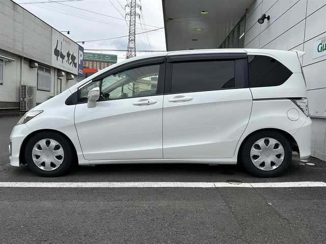 ホンダ フリード G プレミアムエディション 長崎県 2016(平28)年 5.9万km ホワイトオーキッドパール ワンオーナー/純正8インチナビ/(CD/DVD/BT/MSV/フルセグ)/バックカメラ/フリップダウンモニター/クルーズコントロール/両側パワースライドドア/ビルトインETC/オートライト/フォグランプ/TEIN車高調/純正サス積み込み